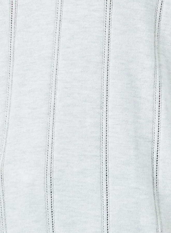 ستايلي قميص بولو محبوك بارز الملمس بقصة مريحة