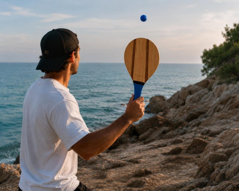Ocean Paddle Premium Set of Wooden Beach Paddles, 2 Frescobol/Beach Tennis Paddles with 2 Balls, Carrying Bag and 2 Sunglasses, Blue Handle - Image 5