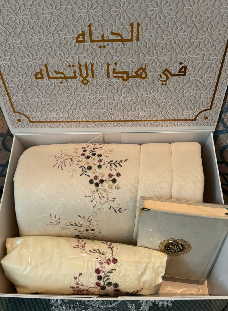 A prayer rug set consisting of 3 pieces, a quilted prayer rug + an embroidered prayer sheet + a Qur’an