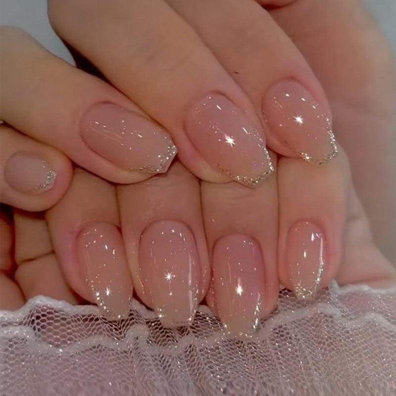 Maigitur Glitter Press on Nails Medium Square Fake Nails with Design Nude Acrylic Nails Shiny Bling Stick on Nails Coffin Full Cover Glossy French Tip Glue on Nails for Women Girls Daily Wear Manicureâ€¦ - Image 1