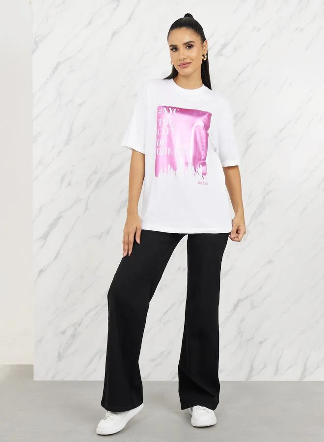 ستايلي Oversized Graphic Foil Print Longline T-shirt