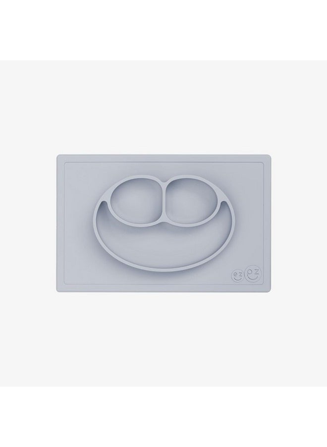 ezpz ezpz Happy Mat - 100% Food Grade Silicone Suction Plate with Built-in Placemat for Toddlers Smile Design Plates Promotes Baby Led Weaning - Divided Plate - Microwave, Oven & Dishwasher Safe (Pewter)  - Image 1