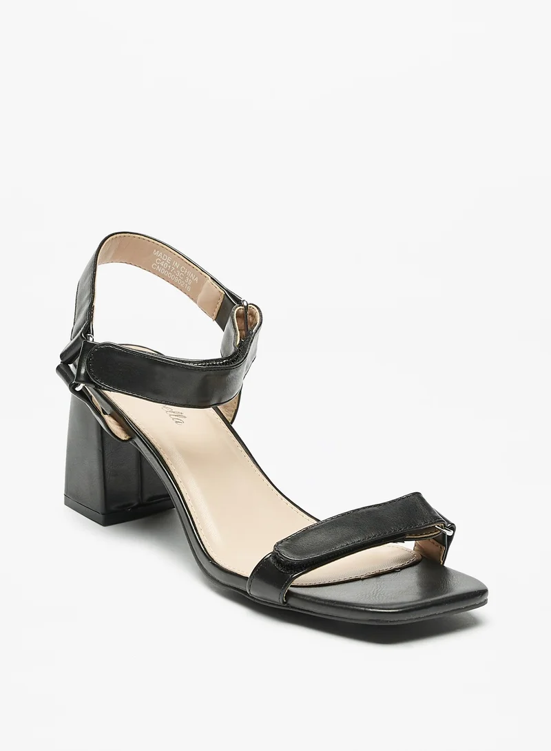 فلورا بيلا من شو إكسبرس Womens Block Heel Sandals with Hook and Loop Closure