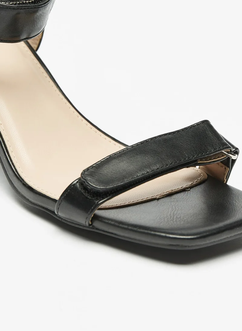 فلورا بيلا من شو إكسبرس Womens Block Heel Sandals with Hook and Loop Closure