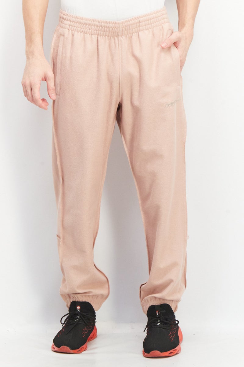adidas Originals Men Relaxed Fit Embroidered Logo Training Jogger Pants, Old Rose  - Image 1