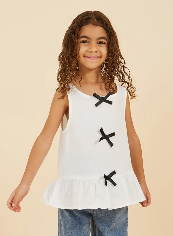 Styli Styli Round Neck Ruffled Hem Blouse with Bow Detail