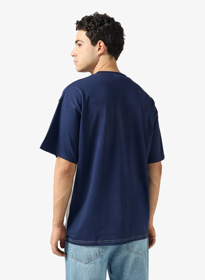 ريبوك تيشيرت تراثي مخيط ومفصل