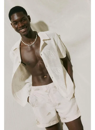 اتش اند ام شورت سباحة منقوش