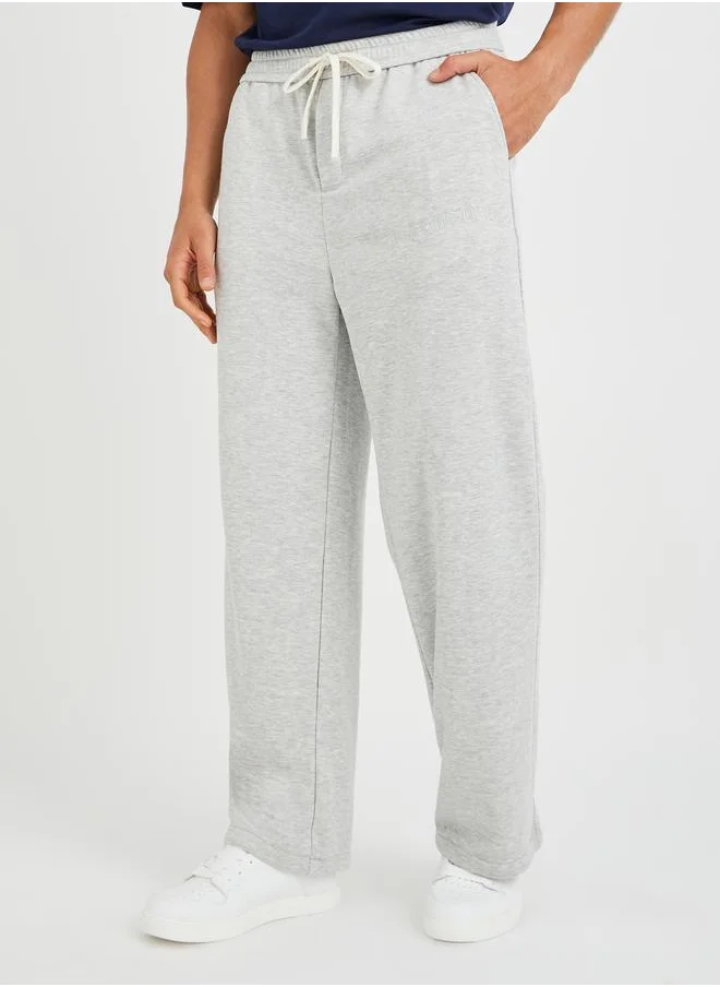 ستايلي Styli Men Grey Solid Oversized Open Hem Joggers with Drawstring Waist