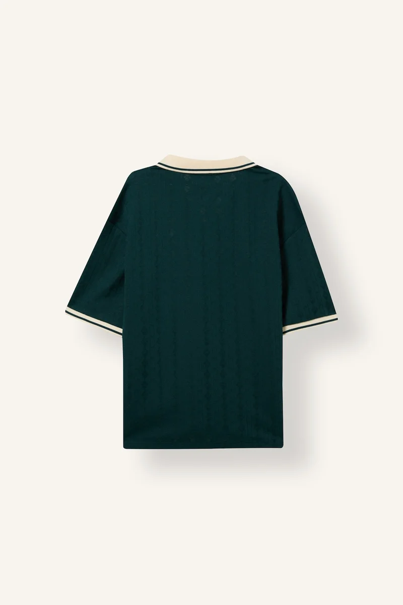 ديفاكتو تيشيرت بولو بأكمام قصيرة وقصة واسعة وطبعة شعار وياقة بولو