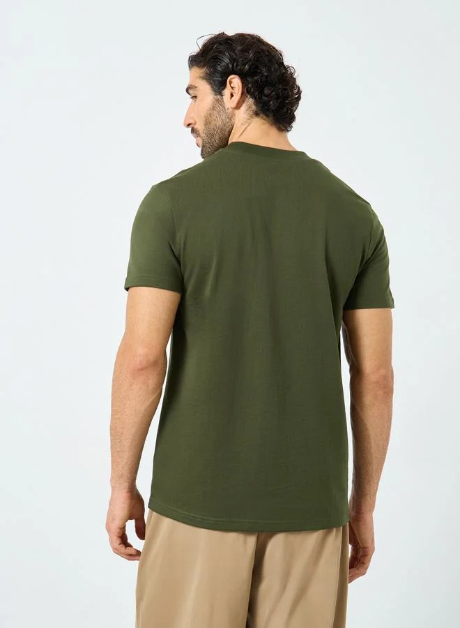 Styli Styli Badge Detail Mock Neck Regular Fit T-Shirt