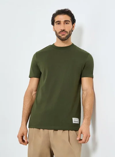 Styli Styli Badge Detail Mock Neck Regular Fit T-Shirt