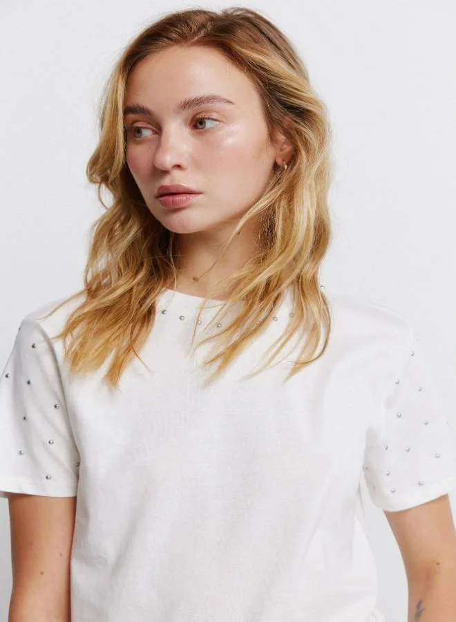 Springfield  Sustainable cotton round neck straight fit short sleeve T-shirt with studs on the neck and sleeves for Women | Best Price UAE