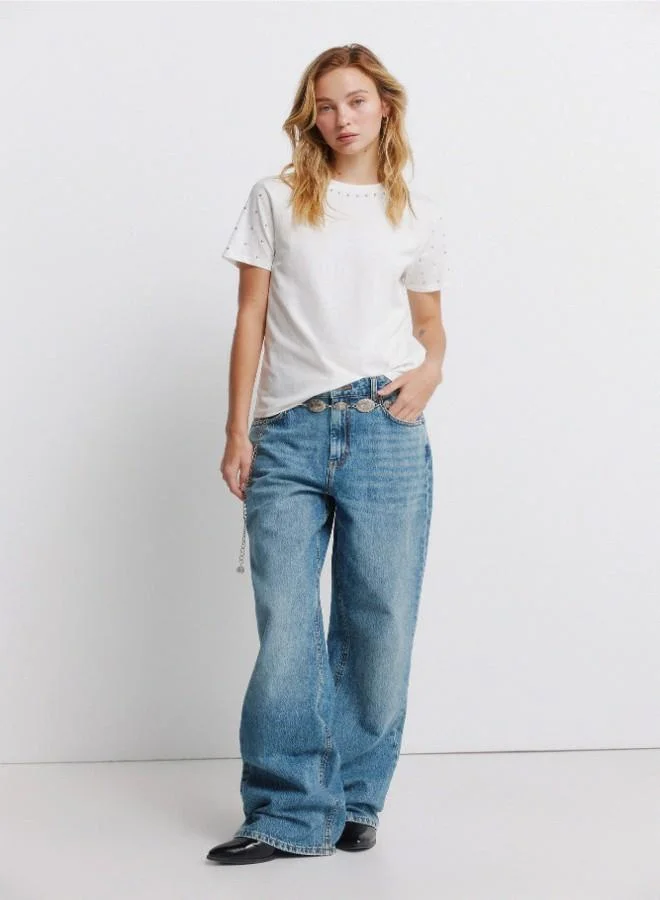 Springfield  Sustainable cotton round neck straight fit short sleeve T-shirt with studs on the neck and sleeves for Women | Best Price UAE