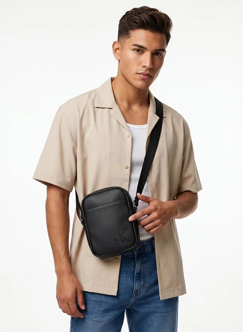 Calvin Klein  Embossed Monogram Logo Slim Reporter Bag for Men | Best Price UAE