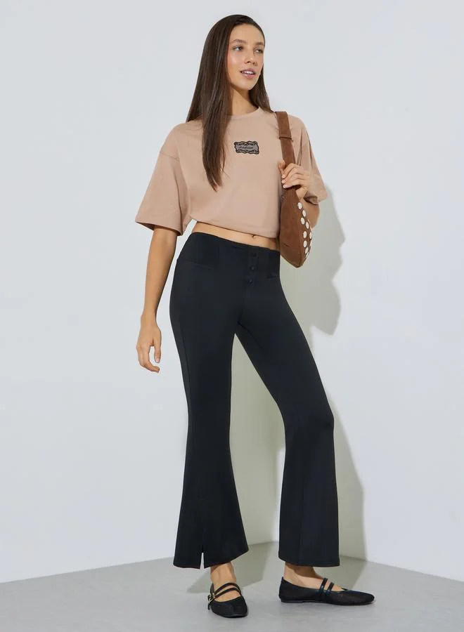 ستايلي Black Solid Flared Pants with Button Detail