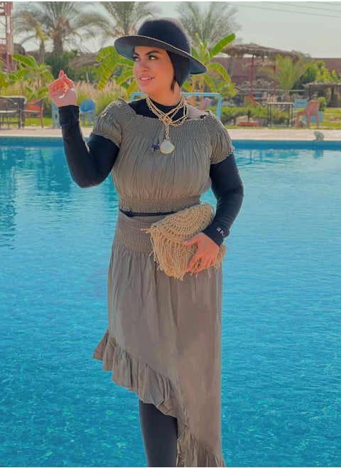 A Set Consisting Of A Plain Top And A Skirt