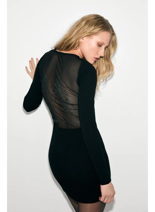 GRIMELANGE ESTRELLA Women's Round Neck Stretch Fabric Back Transparent Mesh Stone Pattern Mini Black Dress.