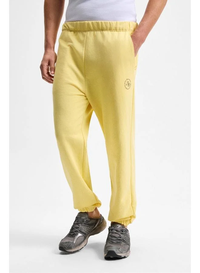 GRIMELANGE YOANE Men's Drawstring Elastic Waist and Cuff Yellow Sweatpants.