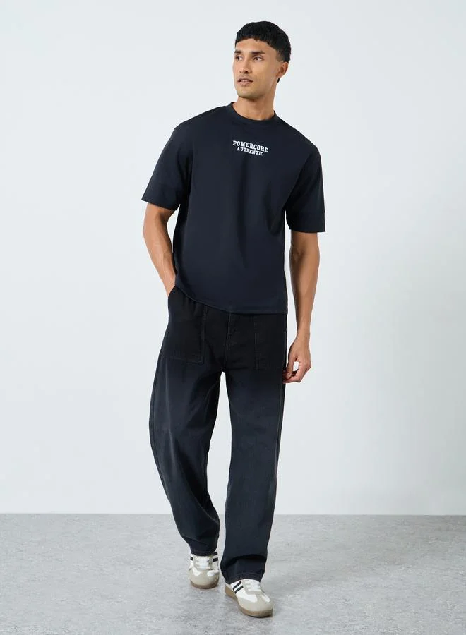 ستايلي تيشيرت واسع بطبعة كتابة