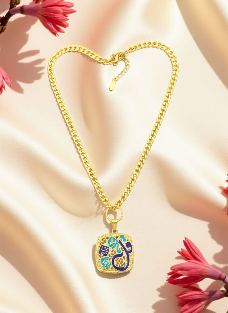 A piece of art that carries a message of reassurance and tranquility in its design. The pendant takes an elegant square shape with rounded edges, decorated with delicate geometric patterns and harmonious shades of gold, blue, and turquoise.

At the heart of the design, the holy verse "Say, I seek refuge in the Lord of the Daybreak" stands out in elegant and attractive Arabic calligraphy. The word "Say" stands out in a larger size and a rich blue hue that steals the spotlight, while the rest of the verse elegantly wraps around it, creating a unique artistic masterpiece.

Dangling from a thick gold chain, this pendant makes for a distinctive and eye-catching piece that adds a touch of elegance and spirituality to any look. - Image 2