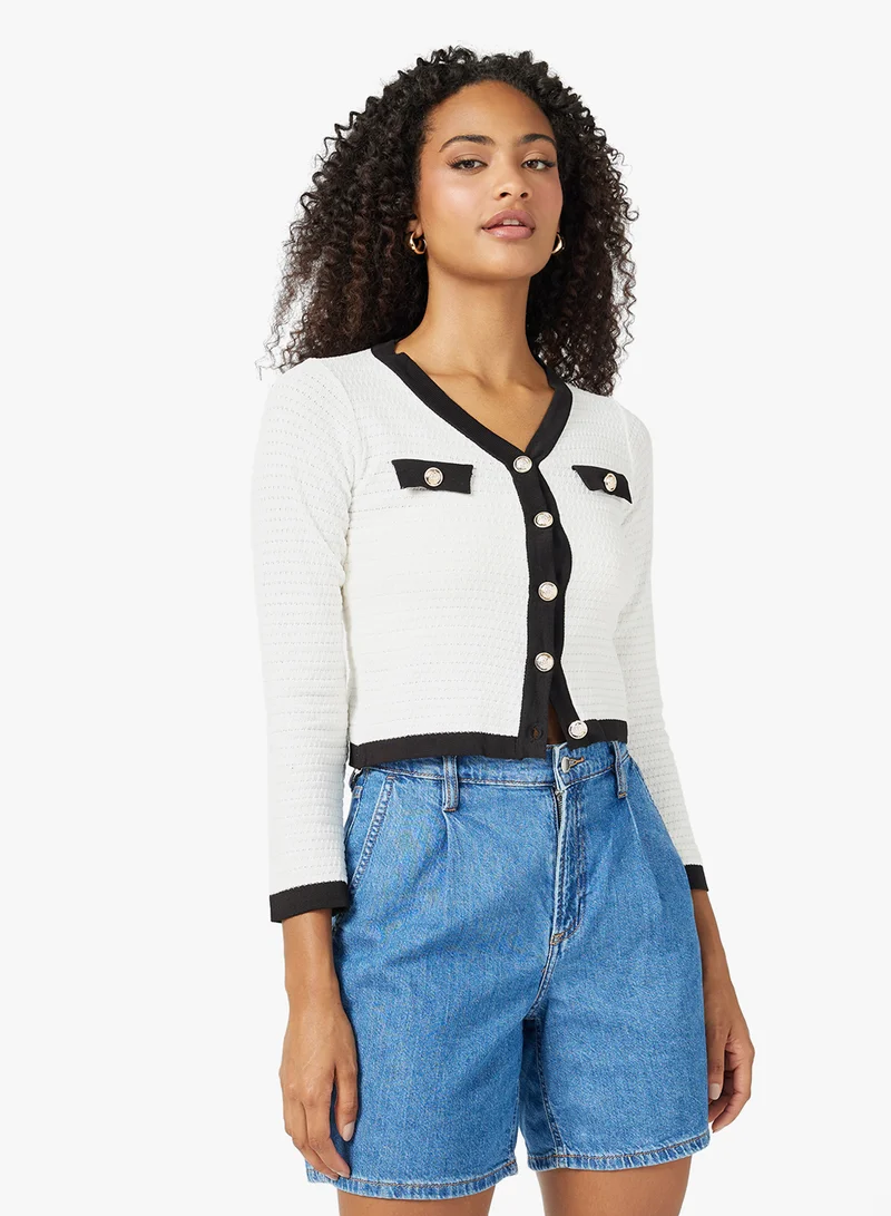 جينجر Classic Monochrome Cardigan with Gold Accents