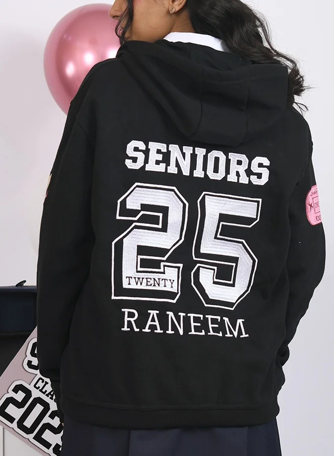 HAWRAA ABAYA Black graduation hoodie with custom embroidery.