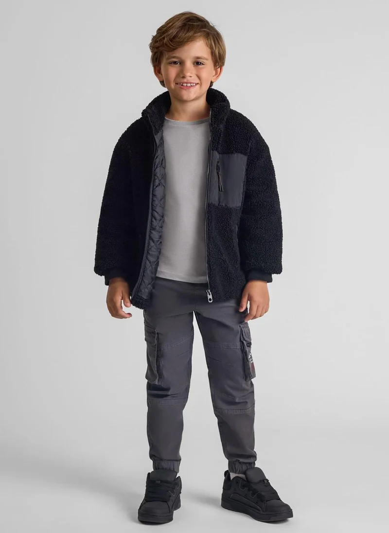 MINOTI Teen Boys Cargo Trousers with Zipped Pockets and a Print