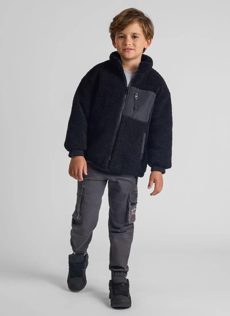 MINOTI Teen Boys Cargo Trousers with Zipped Pockets and a Print