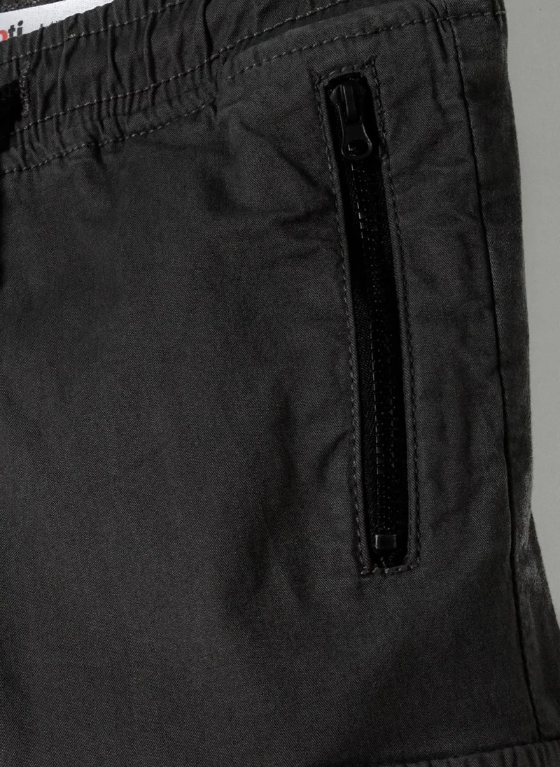 MINOTI Teen Boys Cargo Trousers with Zipped Pockets and a Print