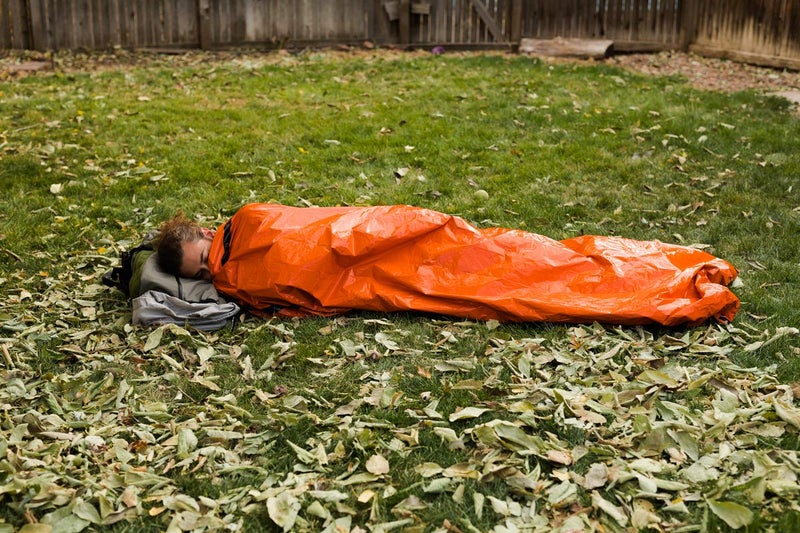 Survival Frog Tact Bivvy 2.0 Emergency Sleeping Bag w/Stuff Sack, Carabiner, Survival Whistle, ParaTinder - Compact, Lightweight, Waterproof, Reusable, Thermal Bivy Sack Cover, Shelter Kit (Orange) - Image 4