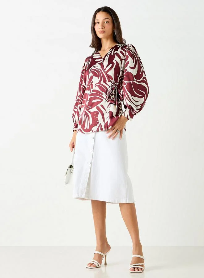 ايكونيك بلوزة ملفوفة بأكمام طويلة وتفاصيل أربطة وطبعات من آيكونيك