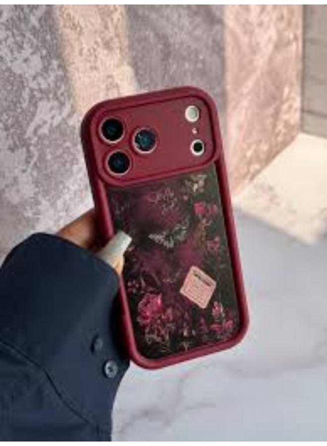 Dark red floral design smartphone case with attached hand strap, shockproof and scratch-resistant, compatible with iPhone 17 Pro Max