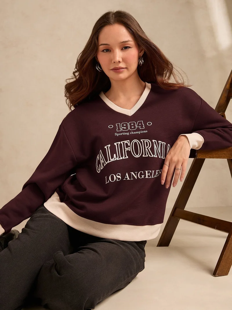 Outzidr  Brown Contrast Neck Graphic Russian Fleece Pullover for Women | Best Price UAE