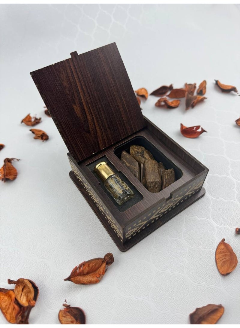 Samrix Brilliance Box: A luxurious wooden box containing 5 grams of enhanced Maroki oud + a quarter tola of premium oud oil. ✔ A luxurious Brilliance Box with an elegant wooden design. ✔ Contains 5 grams of enhanced Maroki oud. ✔ An optional elegant prayer beads (tasbih) available upon request. ✔ Includes a quarter tola of premium oud oil. ✔ Suitable for luxury gifts and giveaways. ✔ Reflects refined taste and Arabian luxury. ✔ An ideal gift for oud lovers. ✔ Suitable for formal and religious occasions. ✔ Luxurious packaging, ready for presentation. ✔ High-quality materials for durability. ✔ Long-lasting, long-lasting fragrance. ✔ Practical yet elegant design. ✔ Ideal for high-end corporate gifts. ✔ Adds a touch of luxury to any occasion. ✔ Reflects authenticity and Arabian heritage. ✔ Suitable for weddings and engagements. ✔ Makes the gift more valuable and distinctive. ✔ A luxurious gift that combines fragrance and spirituality. - Image 1