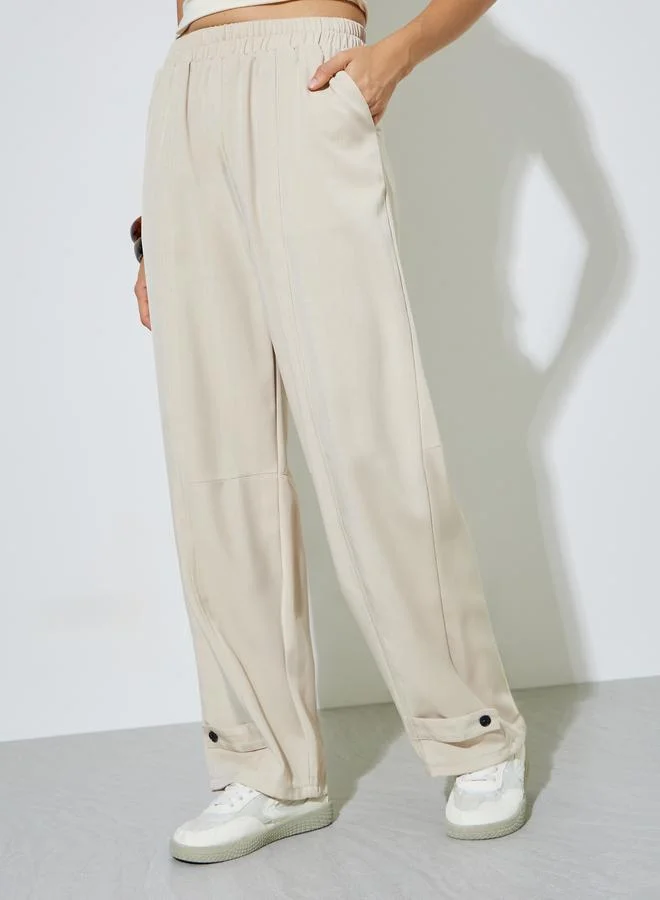 ستايلي Beige Relaxed Fit Pants with Ankle Buttons