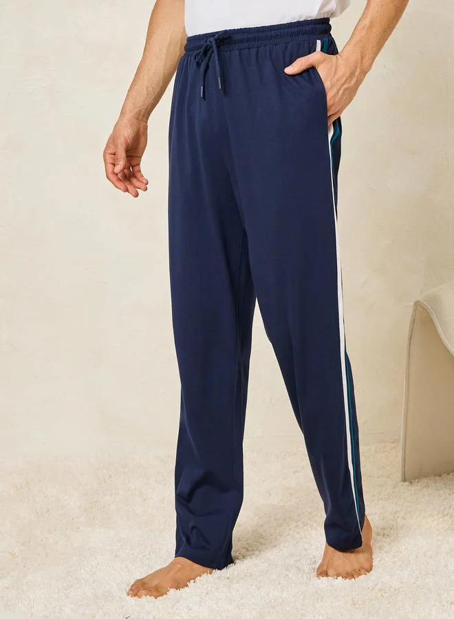 ستايلي Solid T-Shirt & Open Hem Piping Detail Pyjama Set