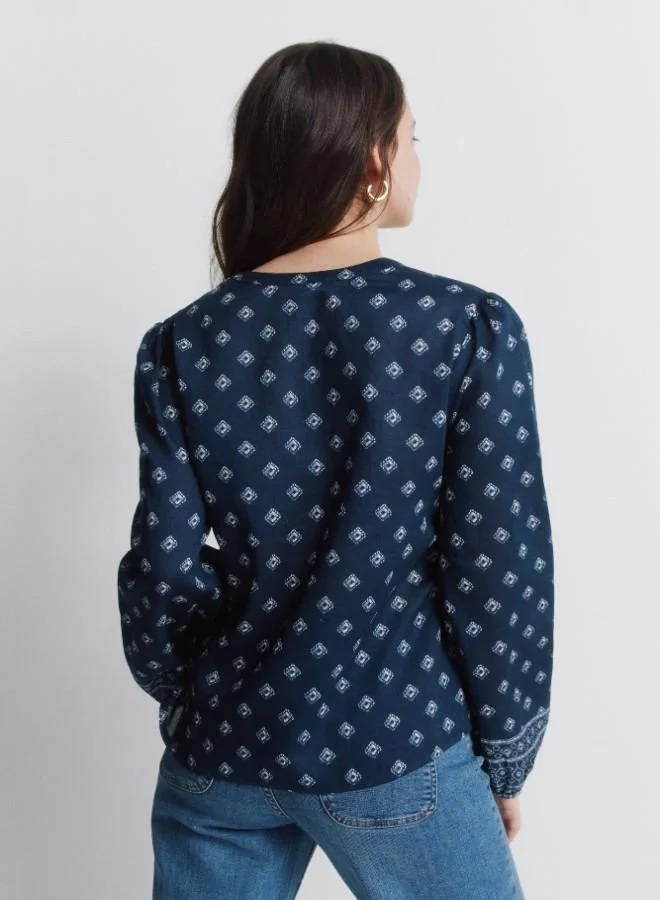 Springfield  Printed voluminous long sleeve shirt. Round neck with V-neck opening. Front buttons. Elasticated cuffs. This garment is made from 100% sustainable cotton. for Women | Best Price UAE