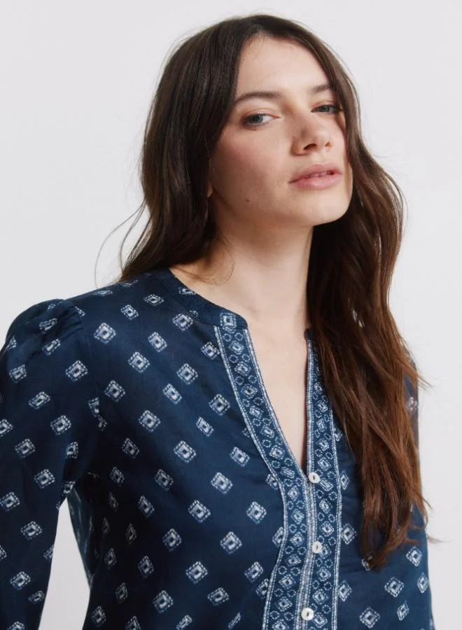 Springfield  Printed voluminous long sleeve shirt. Round neck with V-neck opening. Front buttons. Elasticated cuffs. This garment is made from 100% sustainable cotton. for Women | Best Price UAE