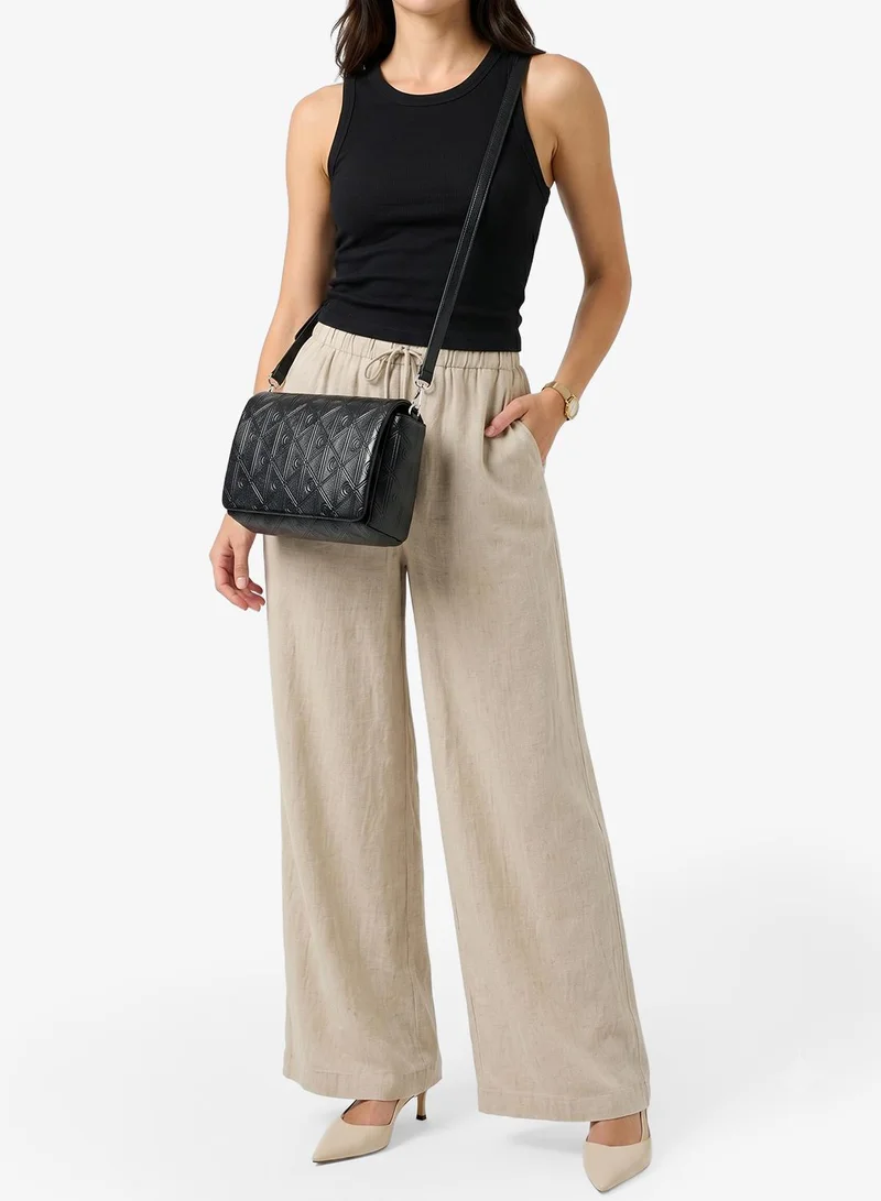 Calvin Klein Black Puffer Emblem Logo Flap Crossbody Bag for Women | Best Price UAE