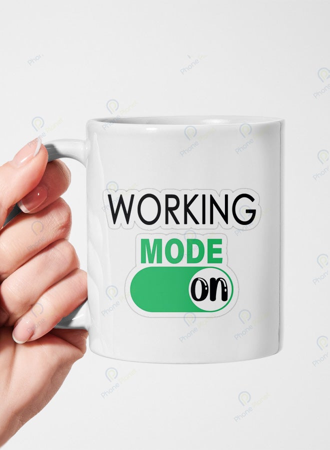 A ceramic mug printed with the word working and featuring a comfortable handle