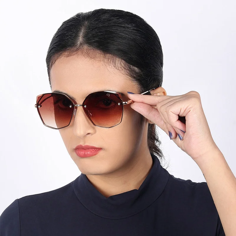 ووجلز نظارة شمسية نسائية أنيقة للحماية من الأشعة فوق البنفسجية بتصميم عصري بدون إطار بلون ذهبي داكن