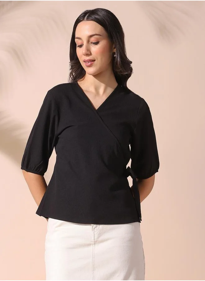 Dennis Lingo Women black regular fit solid half sleeves t-shirt polyester blend top with wrap closure- a fresh take on timeless style.