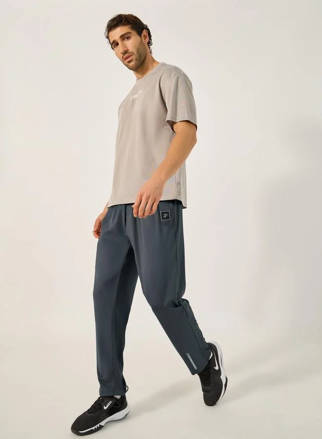 Styli Active Slim Fit Badge Detail Track Pants with Printed Waistband