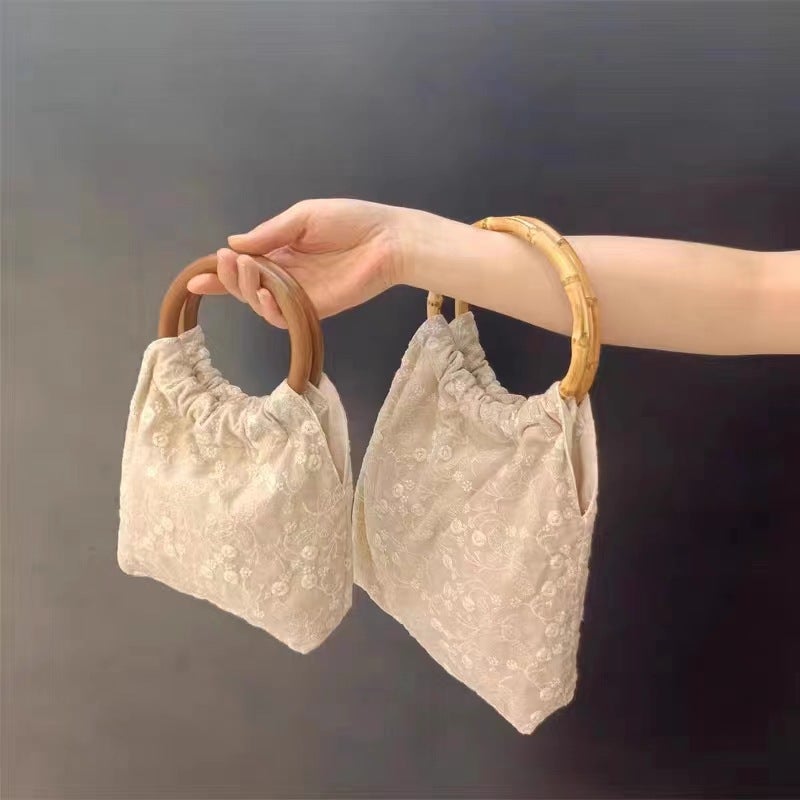 حقيبة دلو صغيرة من القماش مع تطريز زهري - Image 1