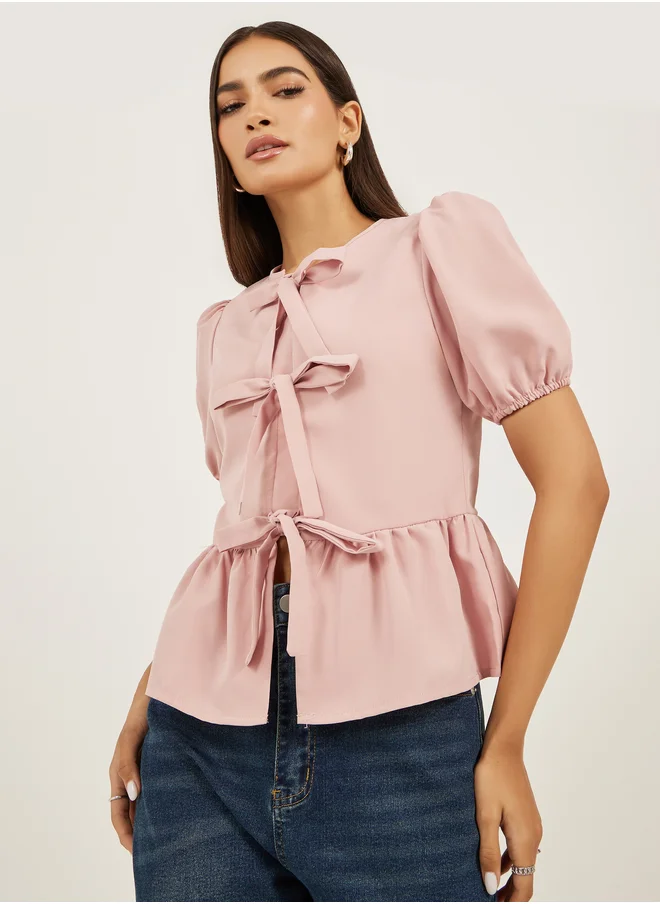 ستايلي Styli Plain Puff Sleeves Peplum Top with Tie Detail