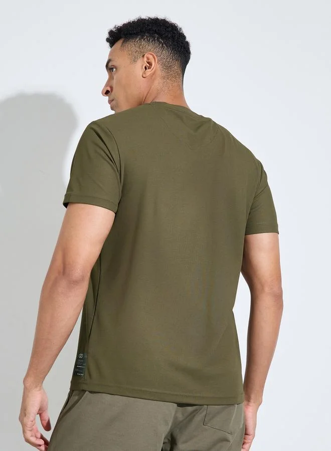 Styli  Olive Solid Patchwork Detail Regular Fit Active T-Shirt for Men | Best Price UAE