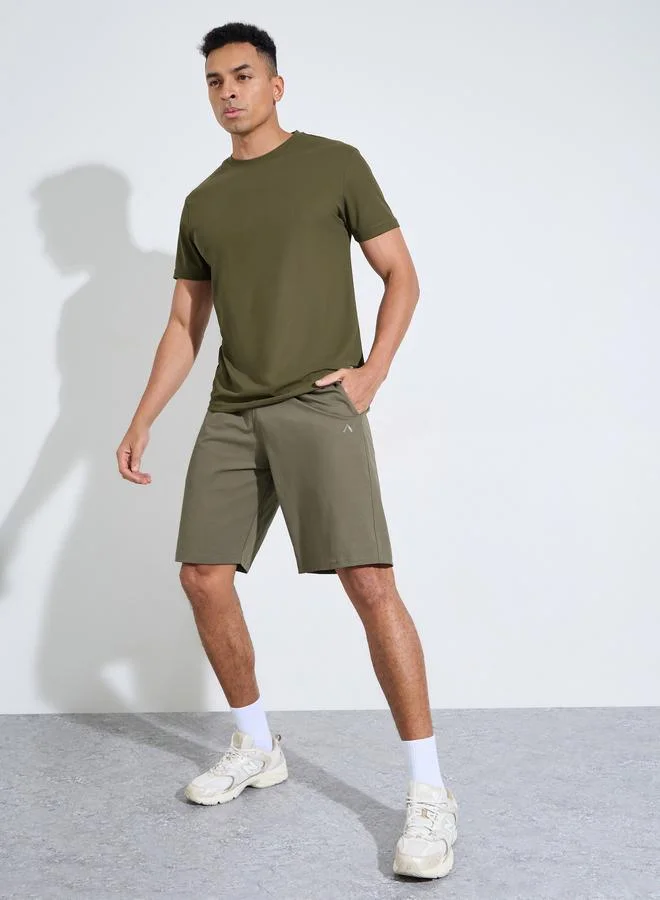 Styli  Olive Solid Patchwork Detail Regular Fit Active T-Shirt for Men | Best Price UAE