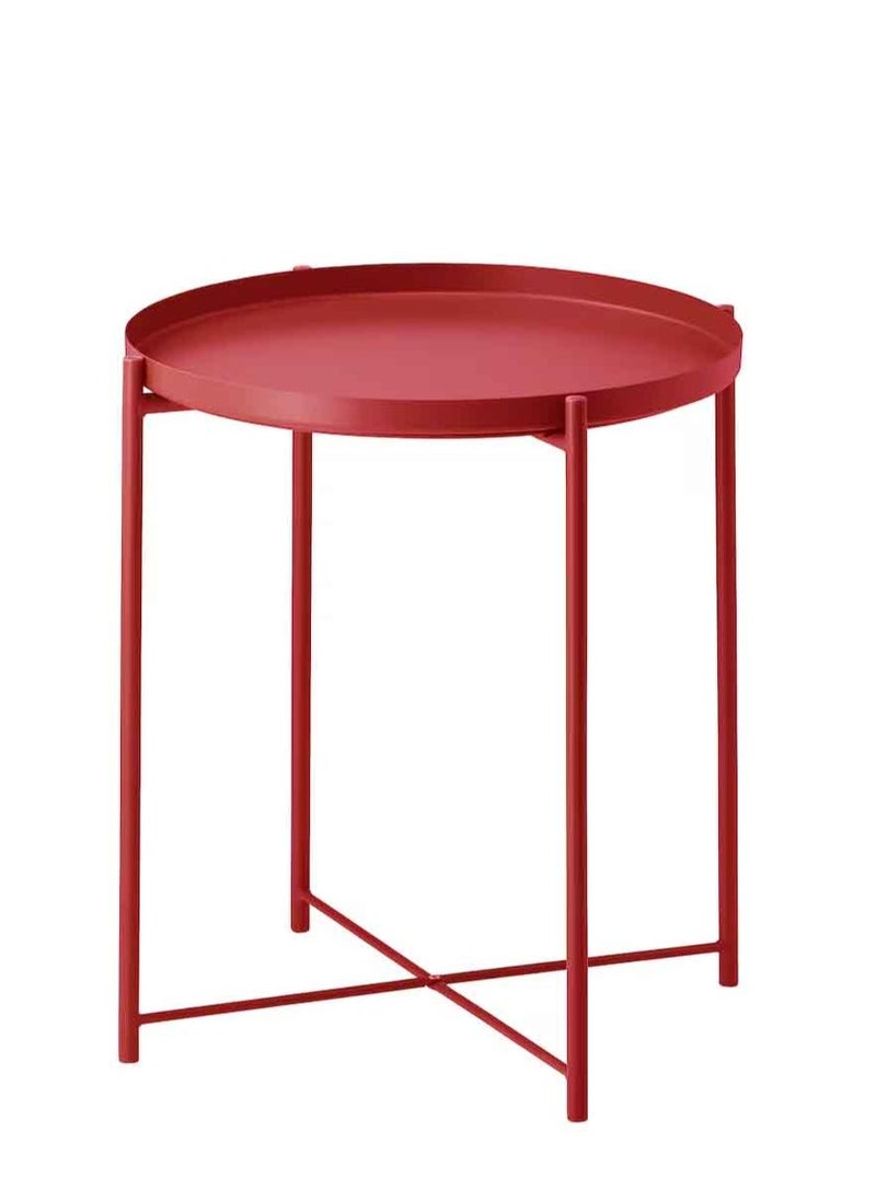 Red metal table in the form of a circular tray
