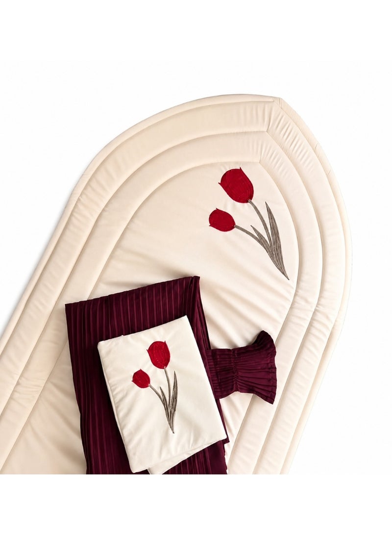 A distinctive Tulip prayer set consisting of a prayer mat with a foam lining in the shape of a mihrab, a plain prayer garment with pleats, and an attached headscarf. One large size for women.